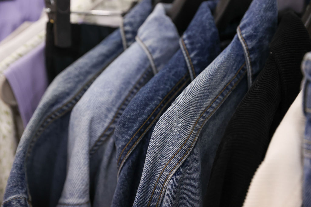 Rack of denim jackets showcasing sustainable fashion materials at Texworld Los Angeles