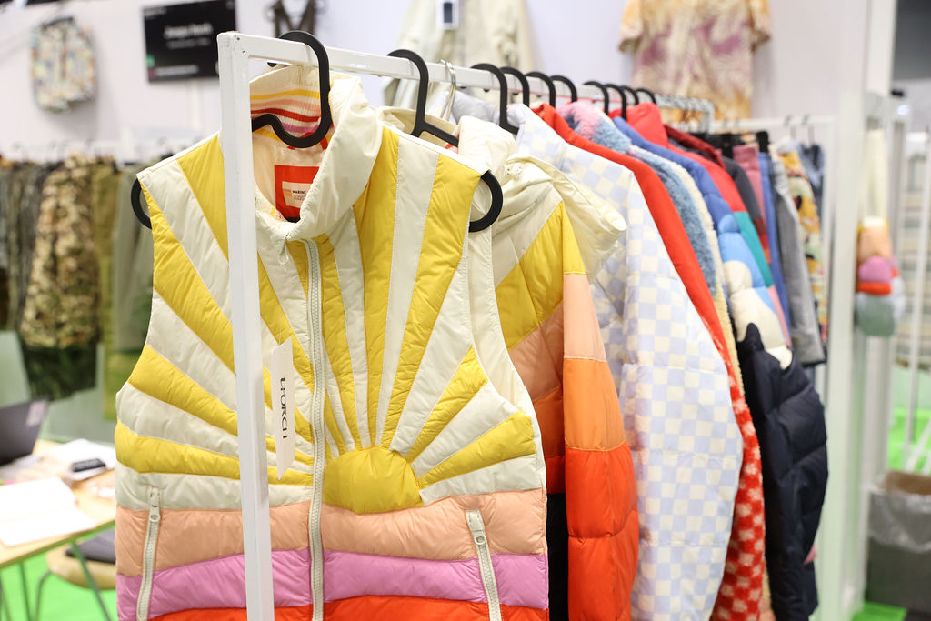 Colorful quilted jackets on display at Texworld Los Angeles, highlighting innovative textile designs